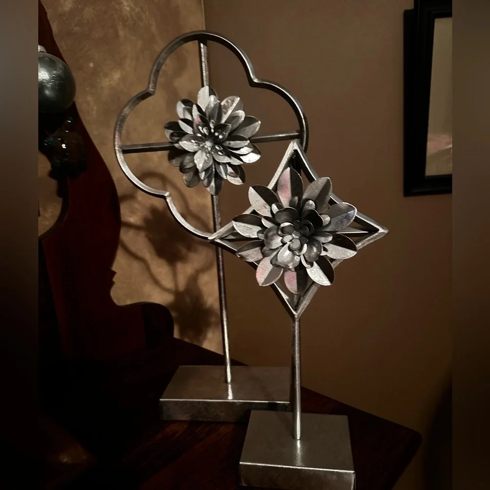 Home decor accents  two silver flowers on pedestal stand